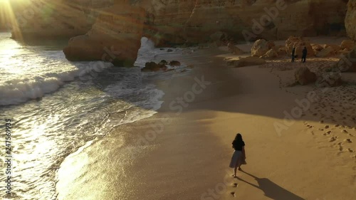 A girl enjoying the sunset in algarve