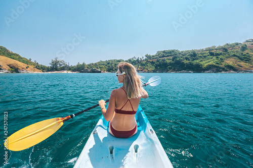 Woman kayaking in Thailand photo