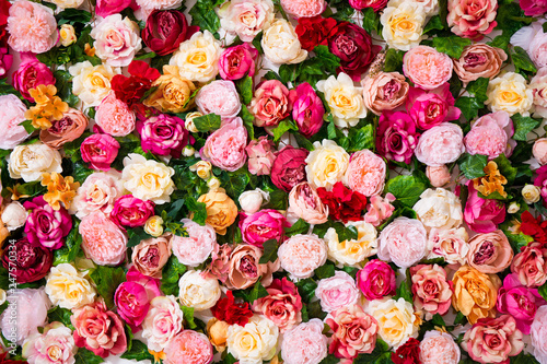 Tableau sur toile wedding decoration - close up of colorful artificial flowers wall background