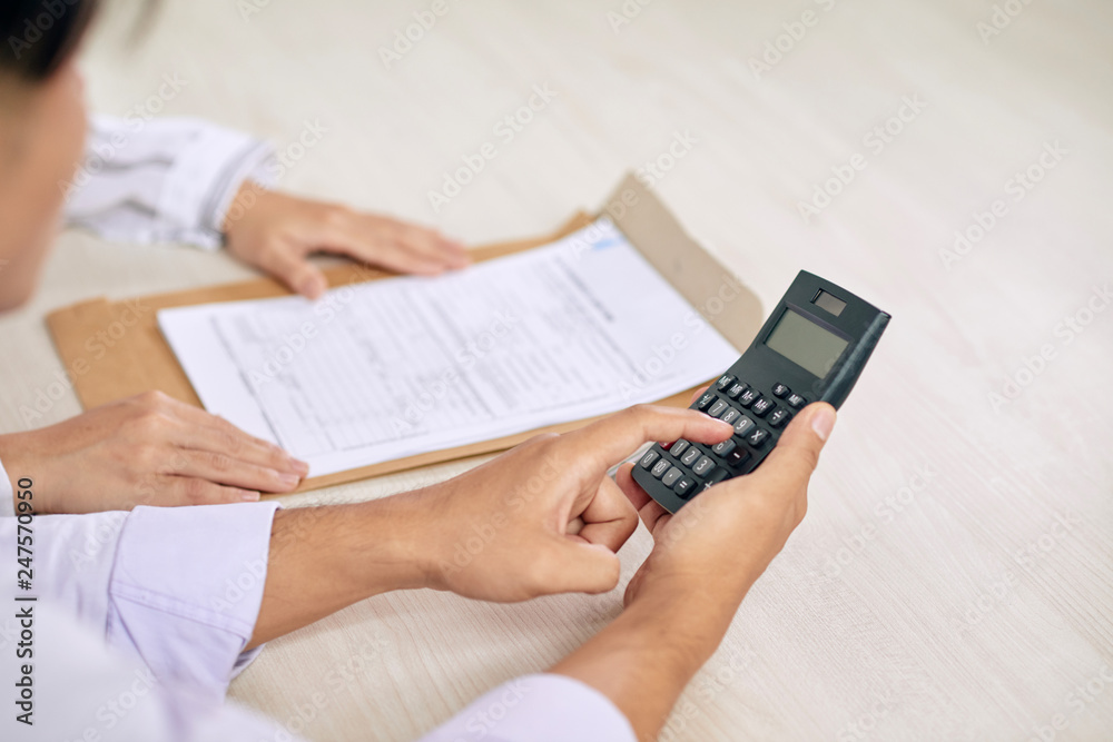 Pointing at calculator Pointing at calculator