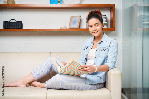 Woman reading the magazine