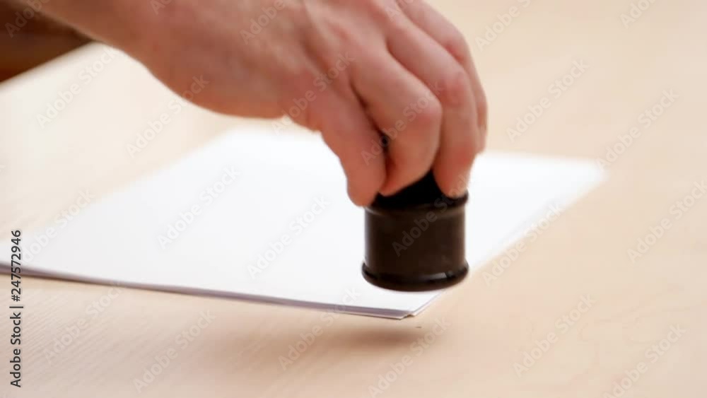 Mans hands laying white blanks, inkpot and iron ruler on beige desk. Close shot. Side view. Preparing for calligraphic lettering. Calligraphic tools on beige table. Blurred background Mans hands laying white blanks, inkpot and iron ruler on beige desk. Close shot. Side view. Preparing for calligraphic lettering. Calligraphic tools on beige table. Blurred background
