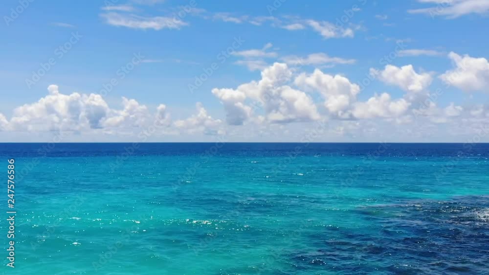 The girl on the ocean. Aerial video from the drone. Seychelles. Beach Anse Police. For advertising. The girl on the ocean. Aerial video from the drone. Seychelles. Beach Anse Police. For advertising.