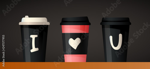 Three cups for coffee or tea on black background with writing I love you on these cups