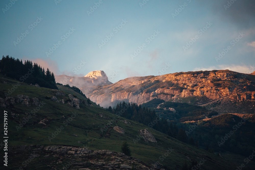Fototapeta premium Sunset in Bucegi Mountains with beautiful blue sky