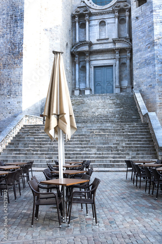 Emty street cafe against catheral in Girona, Spain photo