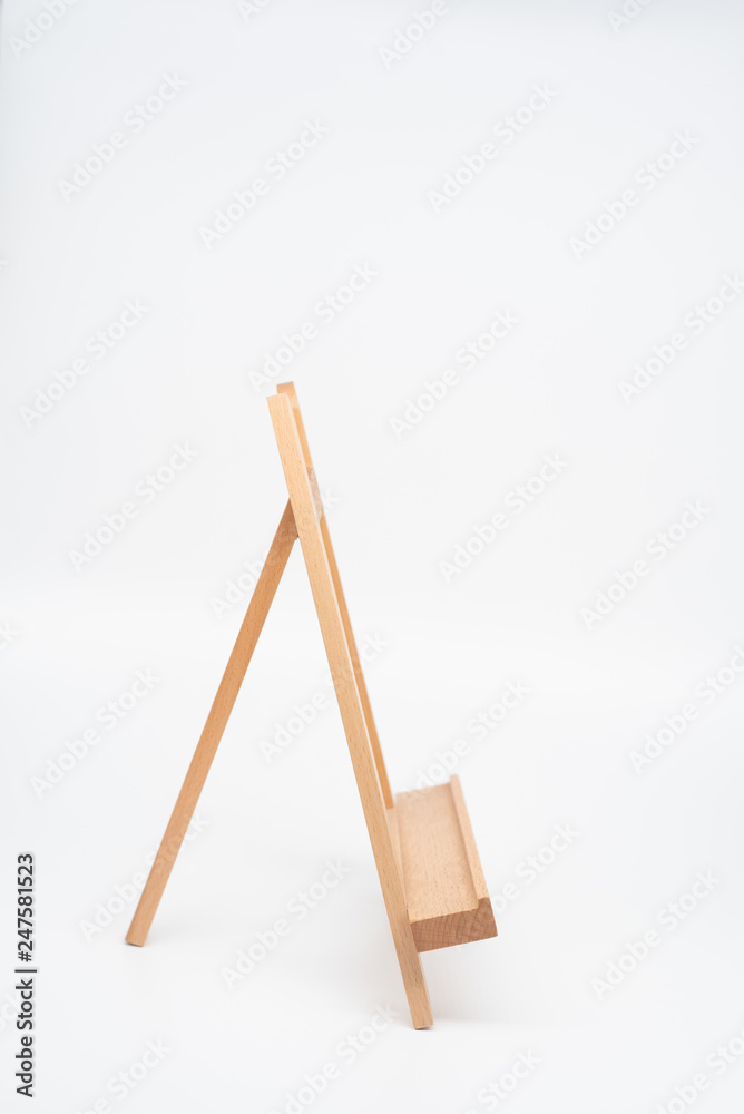 An isolated wooden easel