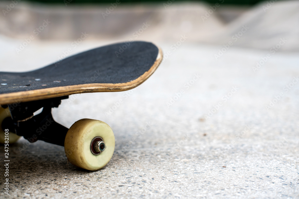 Skateboard close up on a skate park background