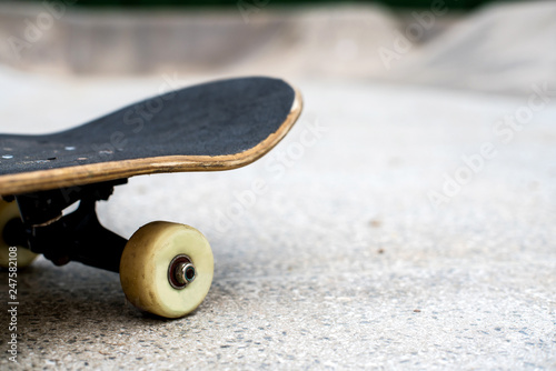 Skateboard close up on a skate park background