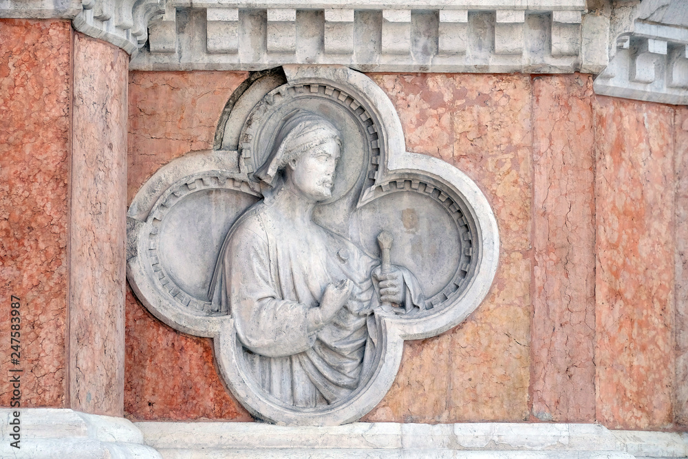 Saint Florian by Paolo di Bonaiuto relief on facade of the San Petronio Basilica in Bologna, Italy