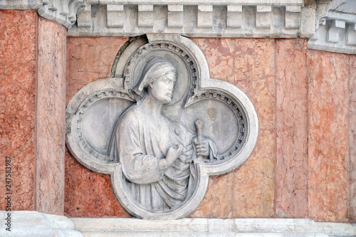 Saint Florian by Paolo di Bonaiuto relief on facade of the San Petronio Basilica in Bologna, Italy photo