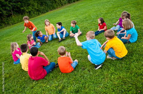 Group of Kids Playing a Game in a Circle Outside