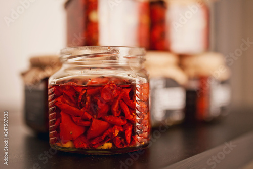 Sun dried tomatoes with olive oil in a glass jar