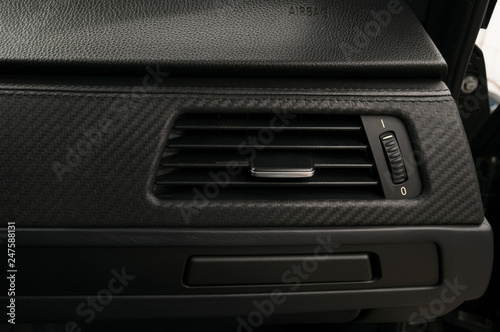 Car air conditioning hole and airbag panel. © alexdemeshko