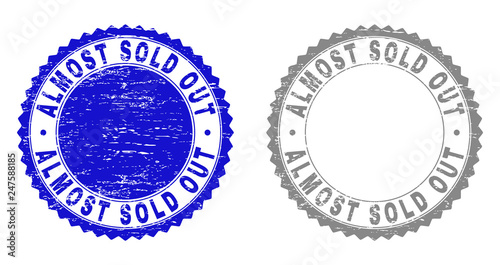 Grunge ALMOST SOLD OUT stamp seals isolated on a white background. Rosette seals with grunge texture in blue and grey colors. Vector rubber watermark of ALMOST SOLD OUT caption inside round rosette.