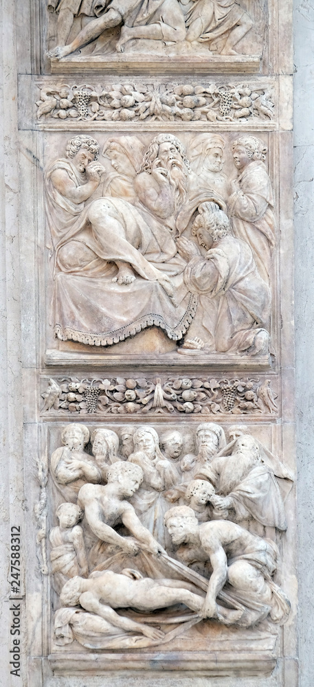 Isaac blesses Jacob by Ercole Seccadenari up and Burial of Jacob's wife by Amico Aspertini, left door of San Petronio Basilica in Bologna, Italy
