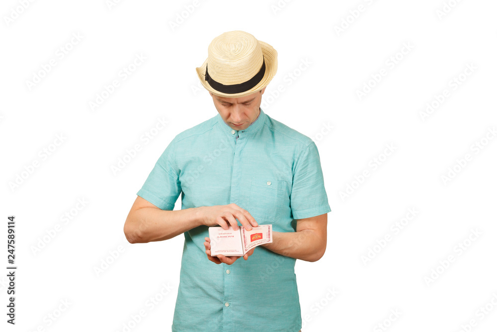 The man looks in the opened international passport The man looks in the opened international passport