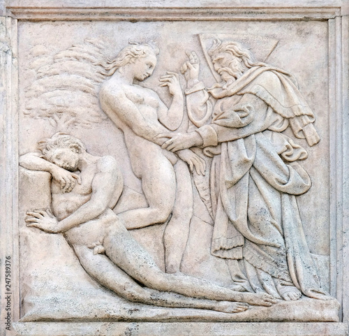 Creation of  Eve, Genesis relief on portal of Saint Petronius Basilica in Bologna, Italy © zatletic