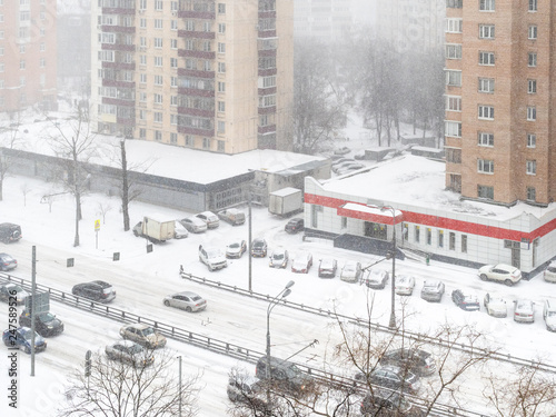 view of street in residential quarter in snowfall photo