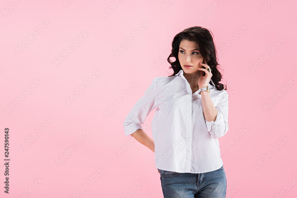 beautiful brunette girl posing in casual clothing, isolated on pink beautiful brunette girl posing in casual clothing, isolated on pink