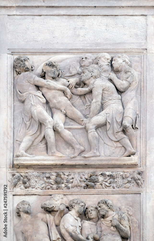 Joseph thrown into the cistern by Amico Aspertini, right door of San Petronio Basilica in Bologna, Italy