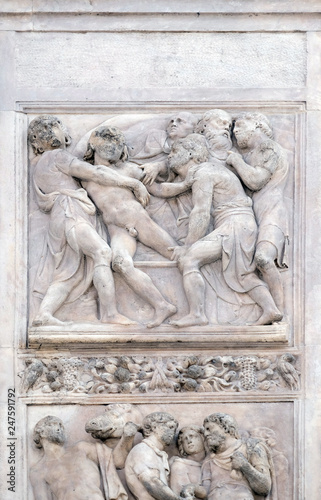 Joseph thrown into the cistern by Amico Aspertini, right door of San Petronio Basilica in Bologna, Italy
