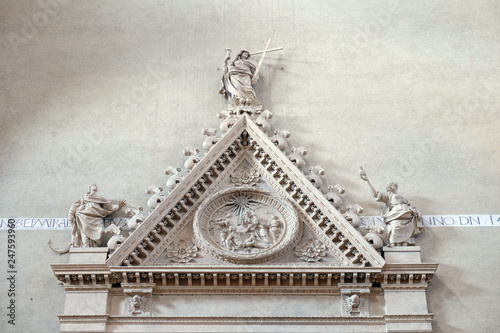 Relief on the inside facade in San Petronio Basilica in Bologna, Italy photo