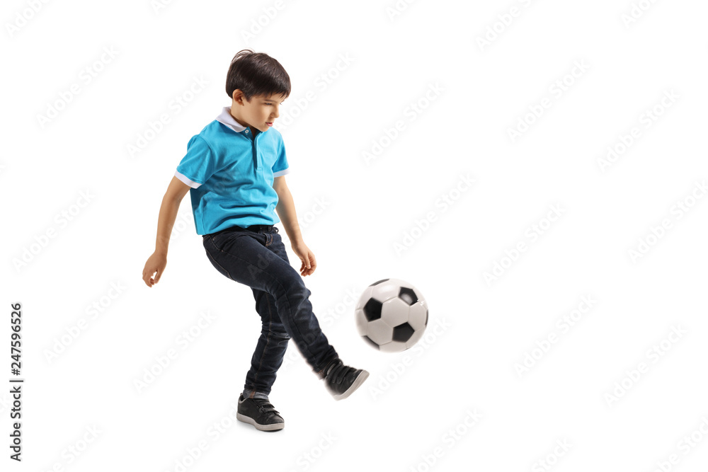 Full length shot of a little boy playing soccer