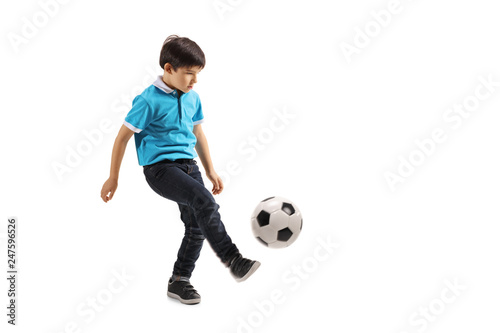 Full length shot of a little boy playing soccer