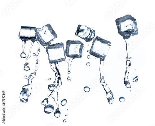 Ice cubes with water splashes on white background