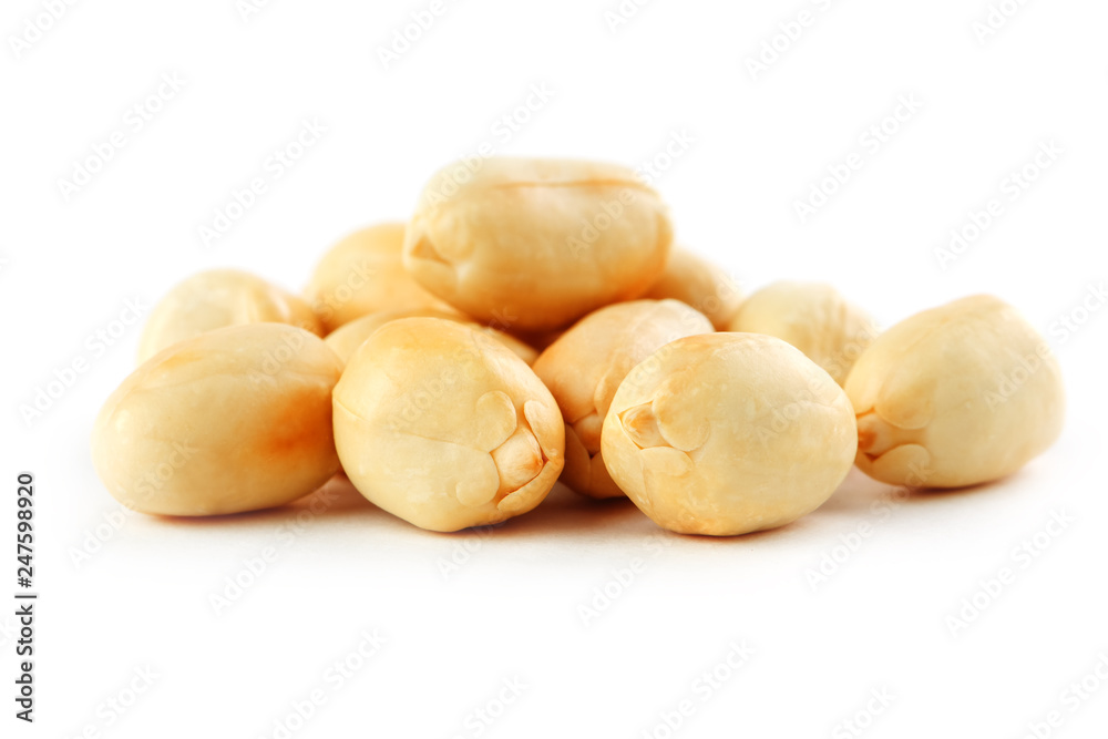 Peanuts isolated on white background. Peeled Peel and Scarlup.