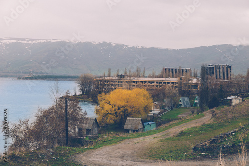 Countryside view to the lake shore with unfinished multy-story houses