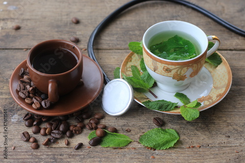 a cup of mint tea and a cup of coffee stethoscope