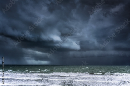  stormy clouds and rain on the sea