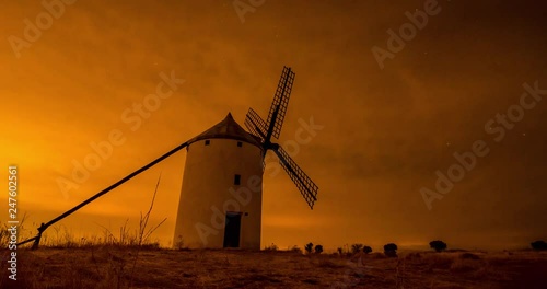 Timelapse of a windmill on a cloudy night