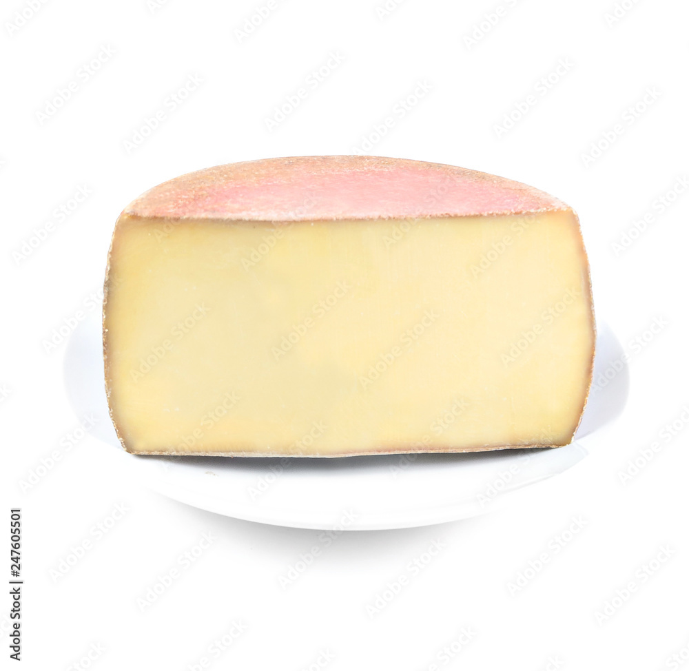 piece of cheese on white plate on white background