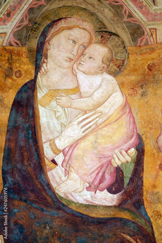 Foto Virgin Mary with baby Jesus, fresco on the house facade in Florence, Italy
