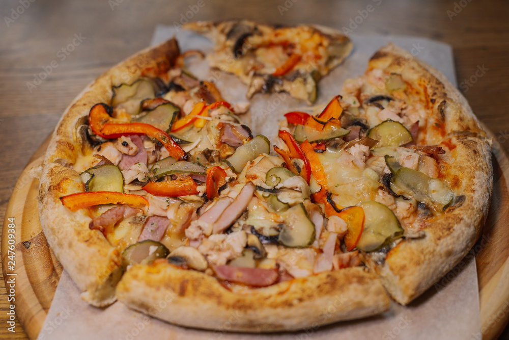 Beautiful fresh hot pizza on a wooden run. Beautiful fresh hot pizza on a wooden run.