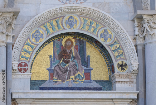 A colourful mosaic by Giuseppe Modena da Lucca, of the John the Baptist, lunette above right door of Cathedral in Pisa, Italy. Unesco World Heritage Site © zatletic