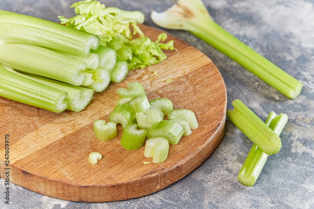 Macro sliced Celery on wooden chopping board. Macro sliced Celery on wooden chopping board.