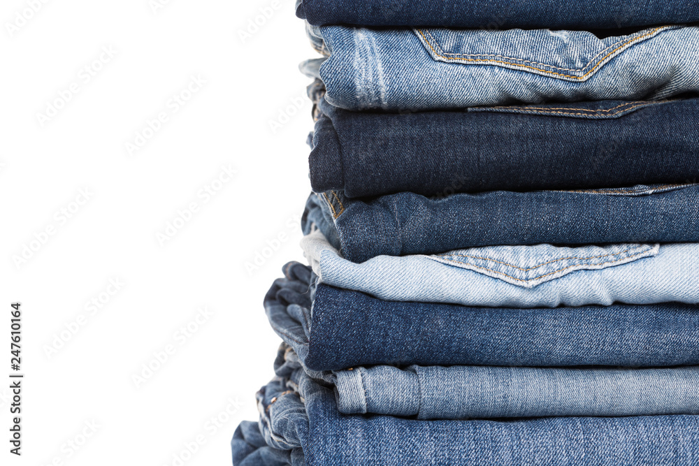 stack of various shades of blue jeans stack of various shades of blue jeans