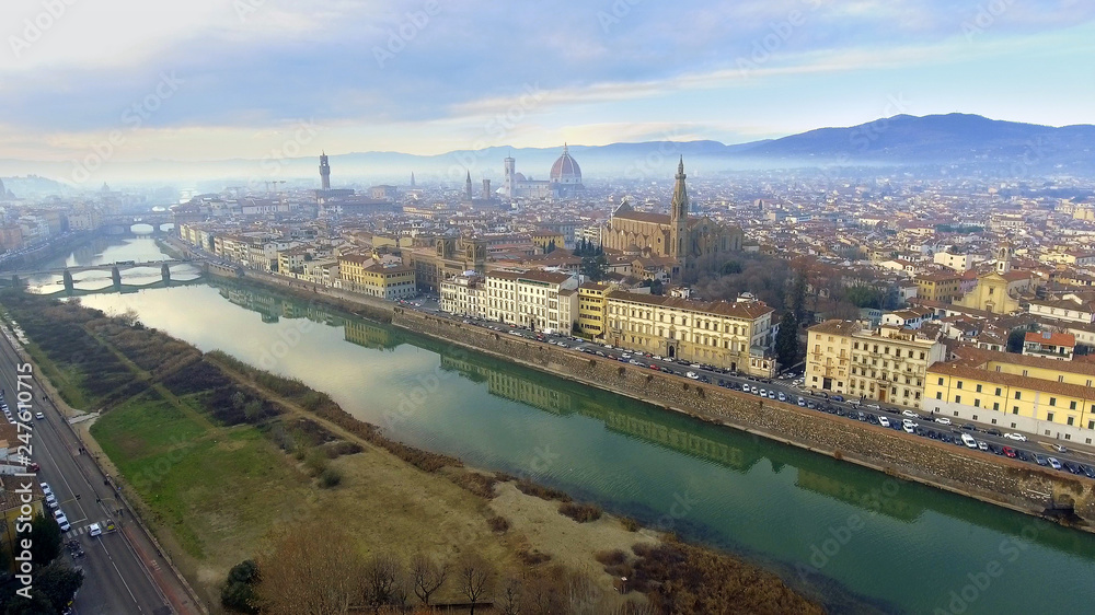 AERIAL. Panorama of the city of FLORENCE in Italy with the dome and Palazzo della Signoria and arno river