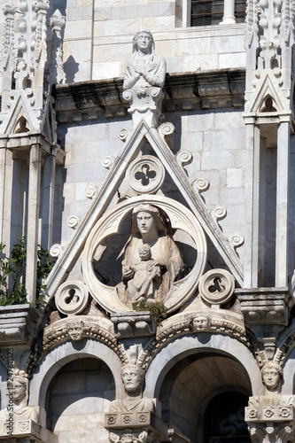 Virgin Mary with baby Jesus, Baptistery decoration architrave arches, Cathedral in Pisa, Italy. Unesco World Heritage Site photo