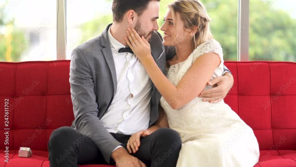 Happy couples, men kissing women cheeks Happy couples, men kissing women cheeks