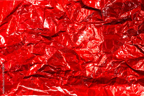 red glossy texture of crumpled metal