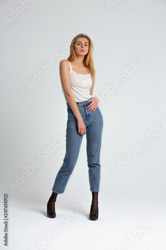 Full length test shooting for attractive young woman wears blue jeans and shirt