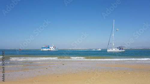 Sailboat in the beach of Farol Island in Formosa Estuary, Algarve, Portugal