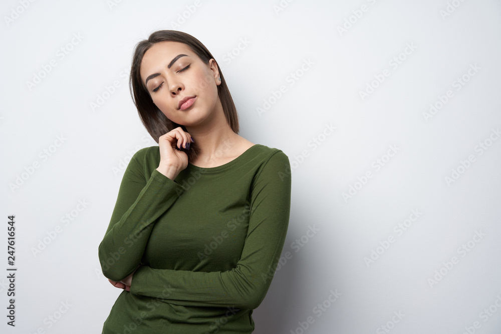 Woman dreaming with closed eyes over white Woman dreaming with closed eyes over white
