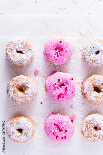 Fresh donuts with powdered sugar photo