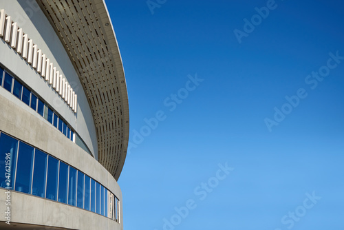 Modern Building with Glass Facade over Blue Sky